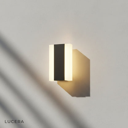 dimmable LED wall light casting soft glow on concrete porch column