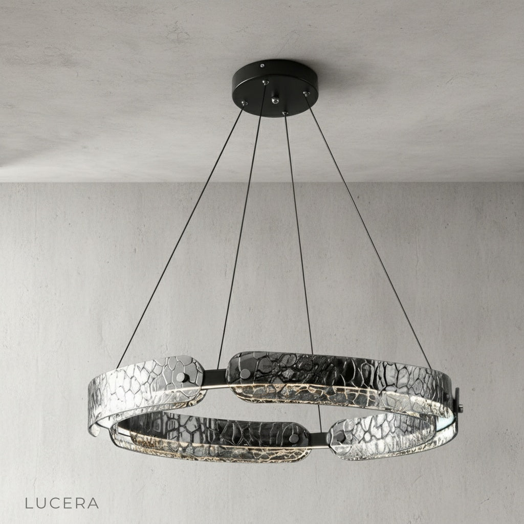 black iron chandelier hanging over contemporary wooden dining table