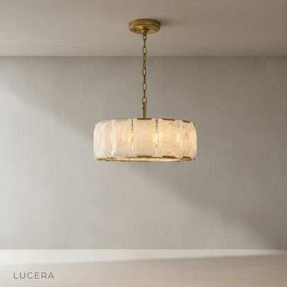 Vivid Round Alabaster Chandelier lit from within showing warm glow through stone panels