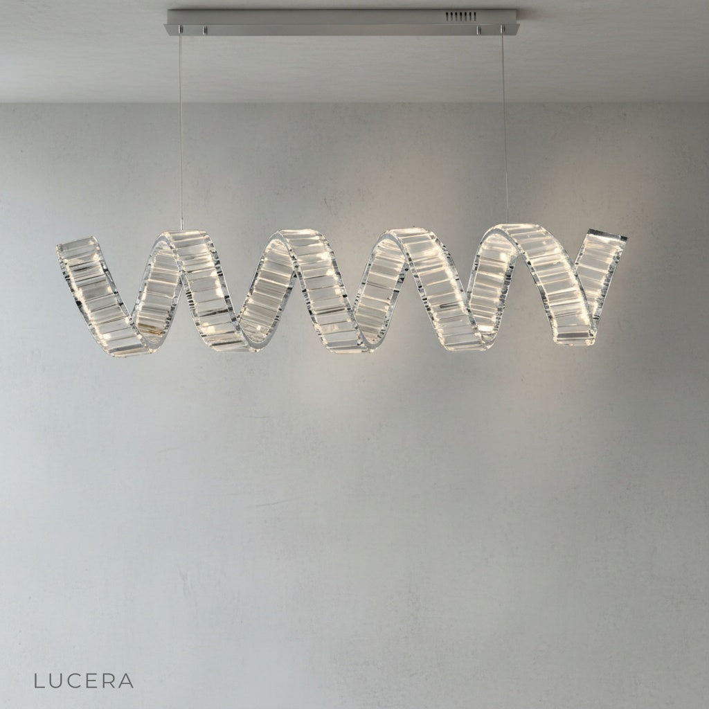 Davy's Grey Chandelier hanging above dining table with soft ambient glow