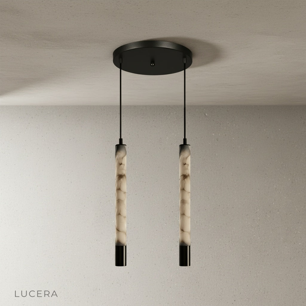 Yseult alabaster pendant light in a cozy bedroom casting diffused warm glow over linen bedding