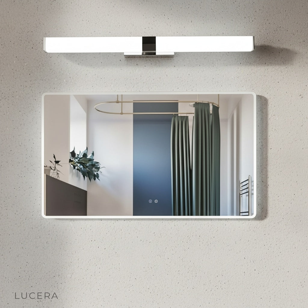 Mystery Wall Lamp illuminating a dark bathroom mirror at night