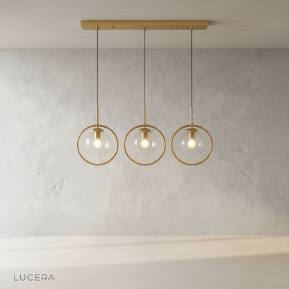 Caelus pendant light in a cozy dining nook with wooden table and warm evening lighting