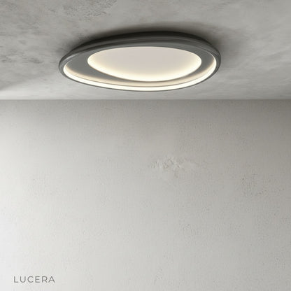 Tantalus ceiling light white chrome finish against dark wall for contrast