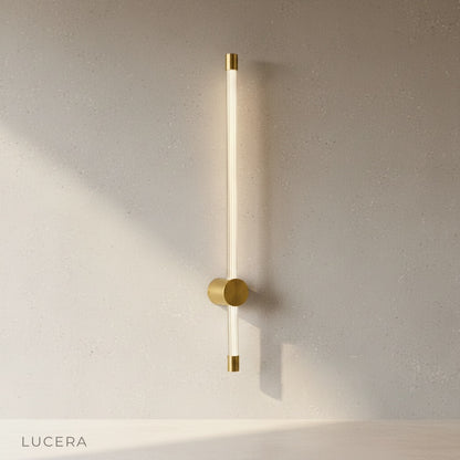 overhead view of yoke wall lamp against textured concrete wall in studio