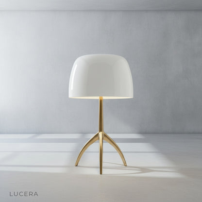 Detail shot of Albescent Table Lamp tripod base joints and metal finish against a neutral wall