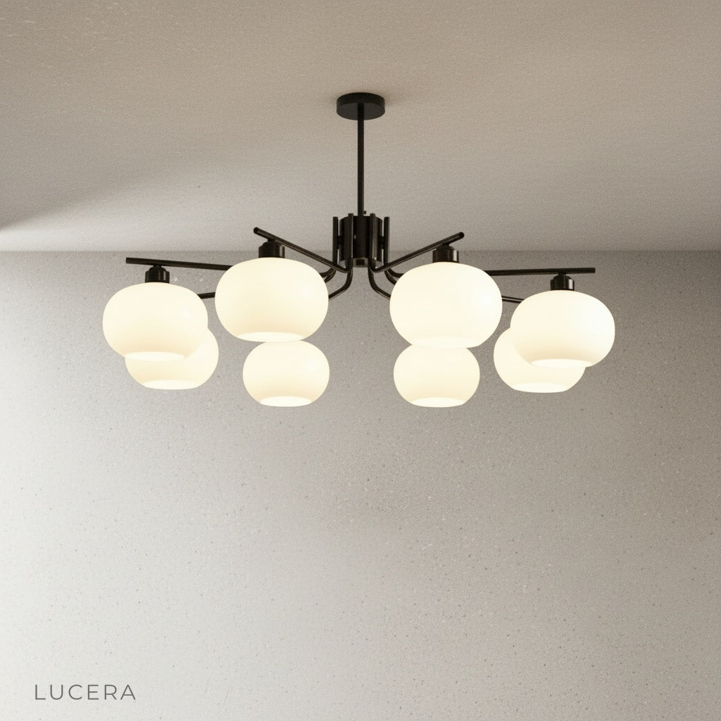 Side-angle studio photo showing the Tempo Chandelier's spherical glass shades and slim metal rods