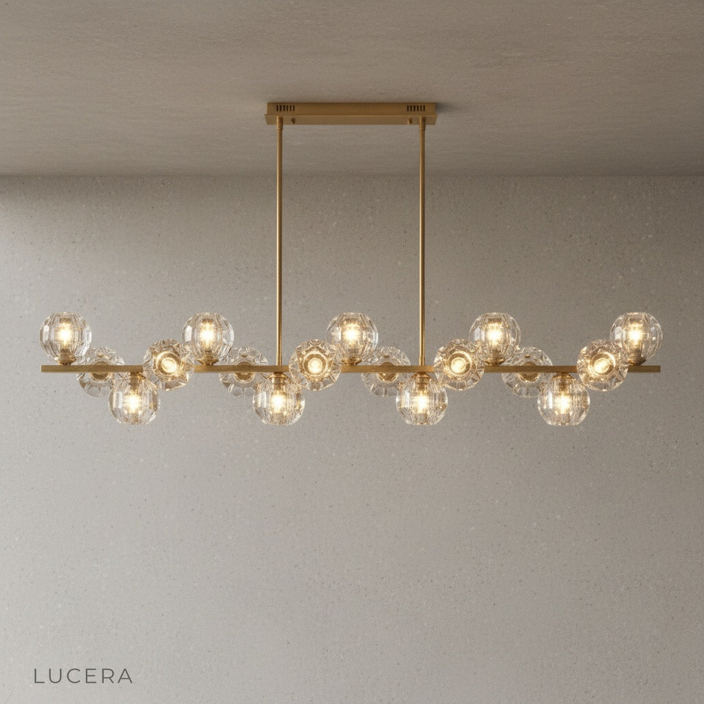 Unisono Linear Chandelier over rectangular wooden dining table in neutral decor