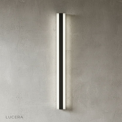 black outdoor wall light above modern concrete bench in minimalist garden setting
