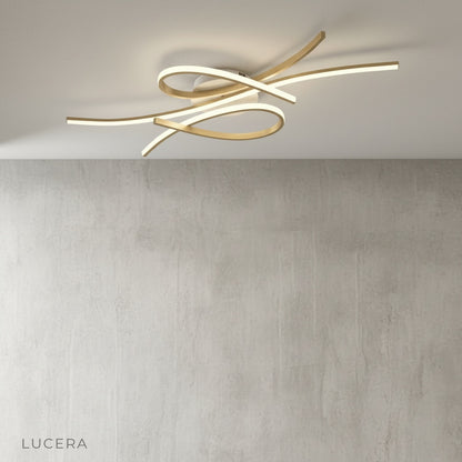 sculptural white and silver LED fixture mounted on modern ceiling