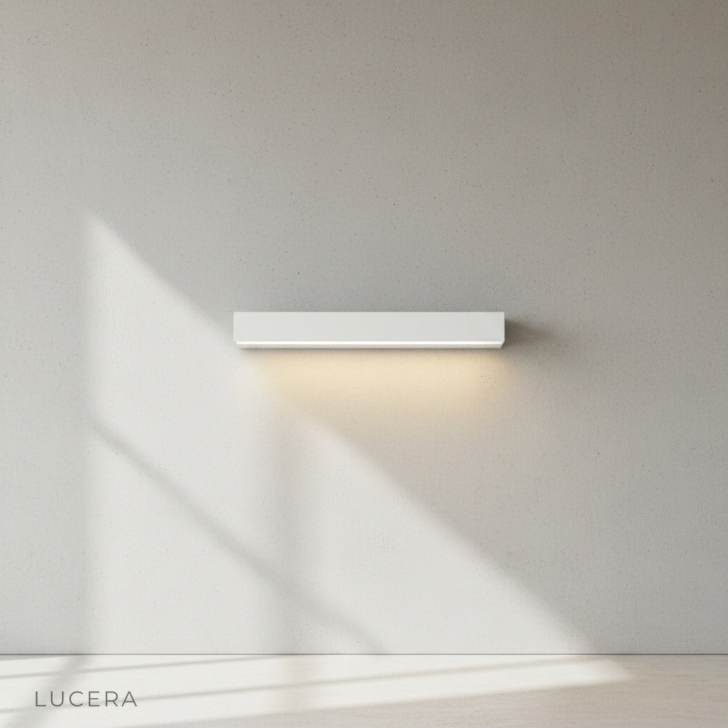 Goccia wall lamp paired with wooden bench on patio, evening warm lighting
