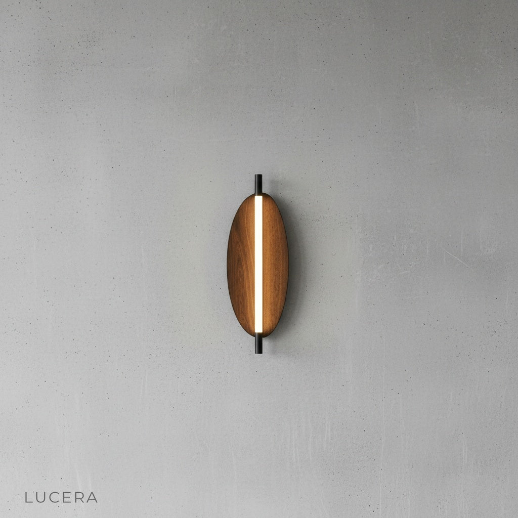 Detail view of Rise sconce side profile highlighting slim sculptural oval silhouette