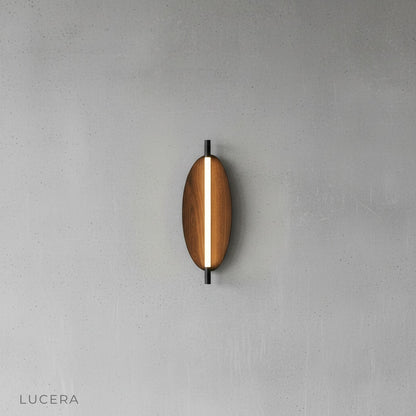 Detail view of Rise sconce side profile highlighting slim sculptural oval silhouette