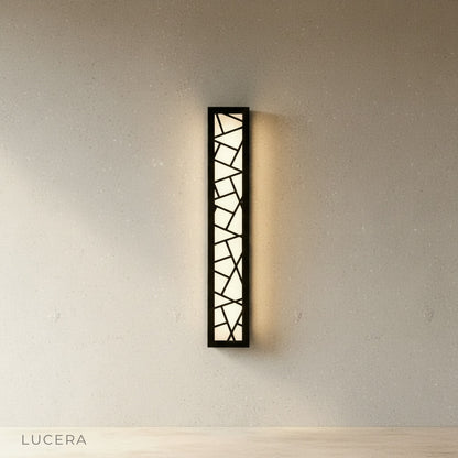 Emblem Wall Lamp highlighting a minimalist outdoor corridor at night