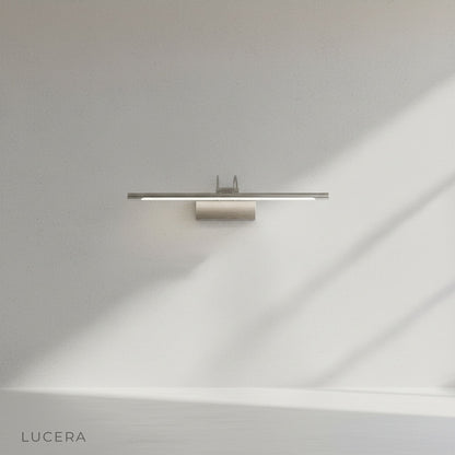 minimalist black wall light accenting a neutral bedroom wall at dusk
