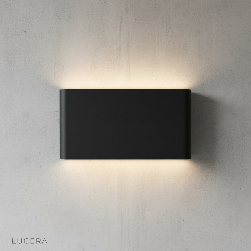 Cadmium wall lamp in hallway with minimalist decor and warm light