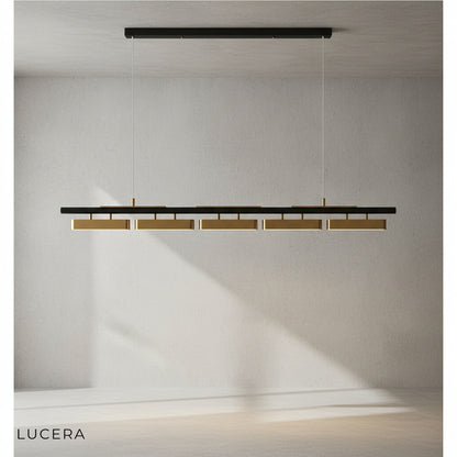 Oskar LED chandelier with gold accent finish in a modern living room near a neutral sofa