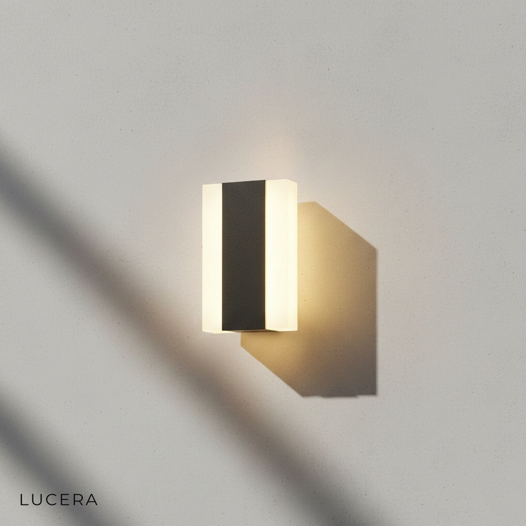 pair of Tatum lamps flanking a modern front door with stone veneer