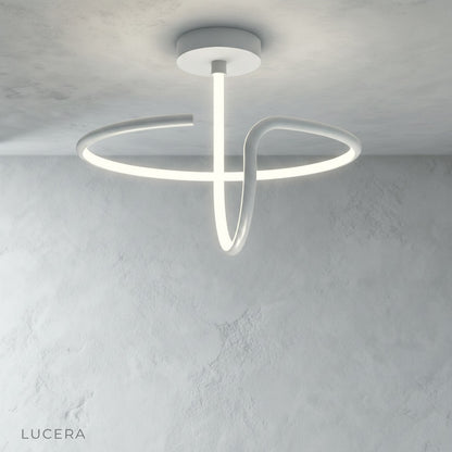 Loom ceiling light with soft diffused light in minimalist hallway