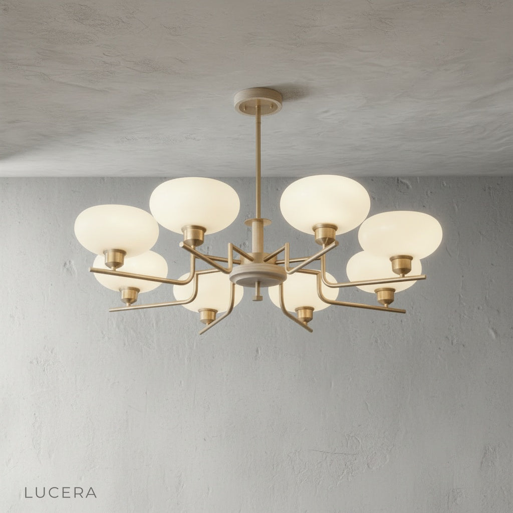 five-head inlet chandelier hanging over a minimalist living room sofa with neutral tones