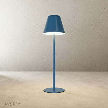 studio shot of yellow table lamp from above showing circular base and shade