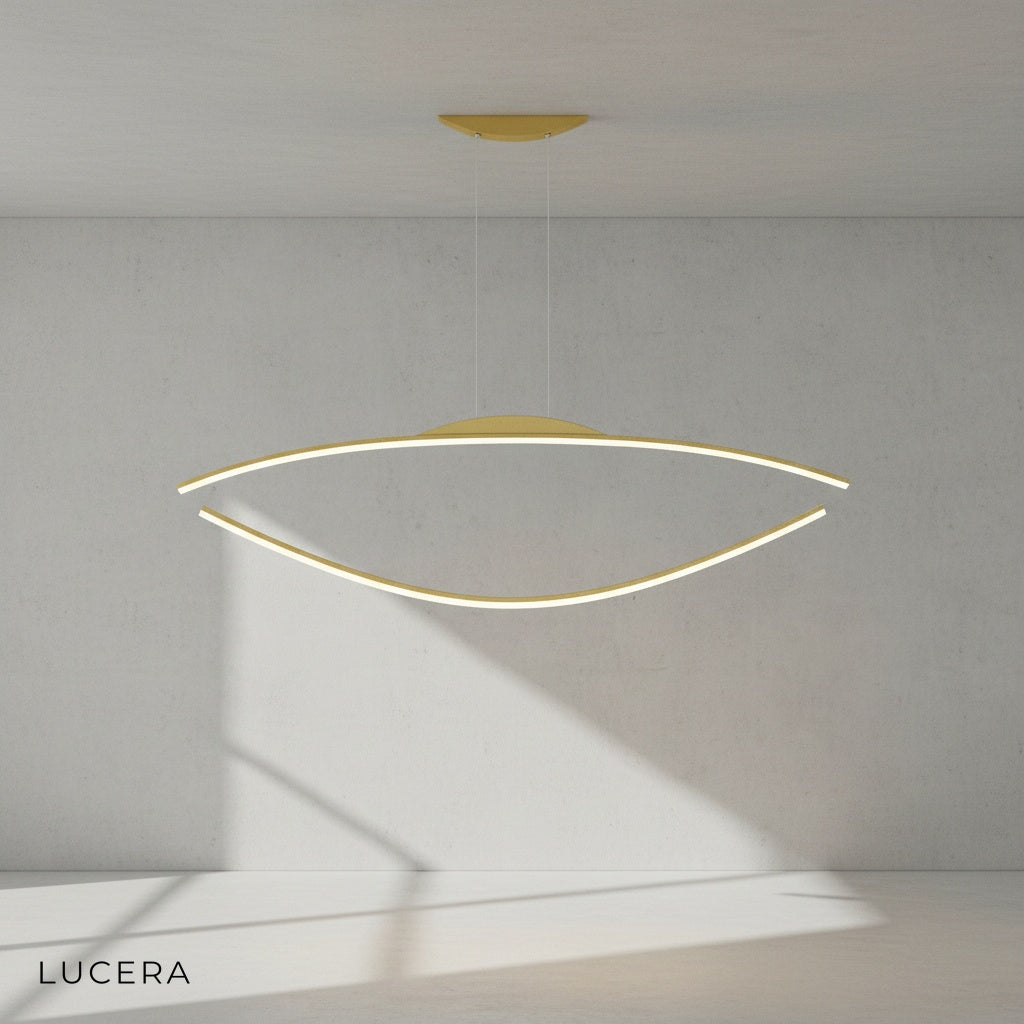 Edda chandelier with sleek silhouette against a neutral gray wall, side angle