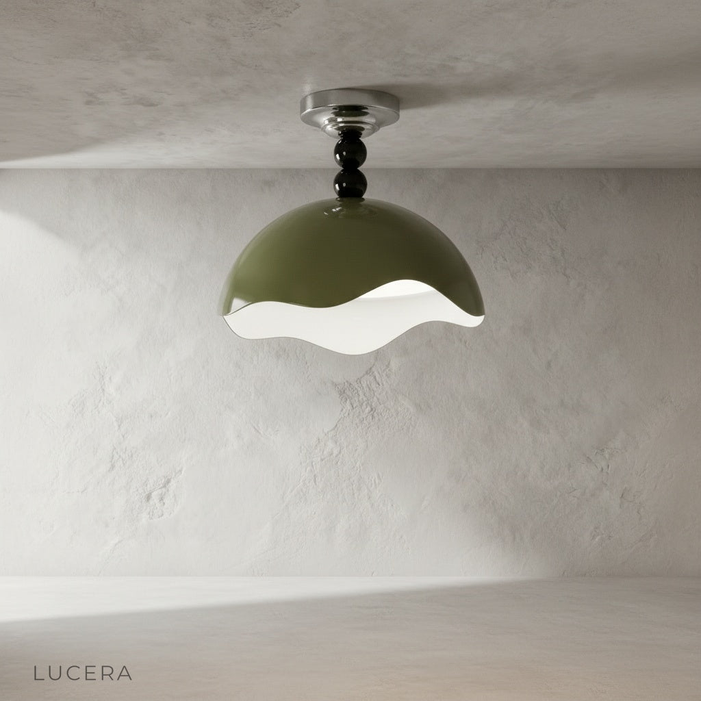 Aegis ceiling light with warm glow over a dining table with wooden chairs