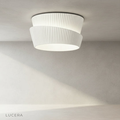 Eulalia pleated shade ceiling light casting ambient glow in dining nook