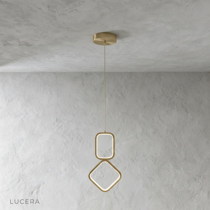 Facade pendant light in brass finish against dark wall for contrast