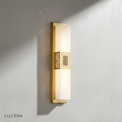 Choral lamp casting ambient light on a textured plaster wall in a hallway