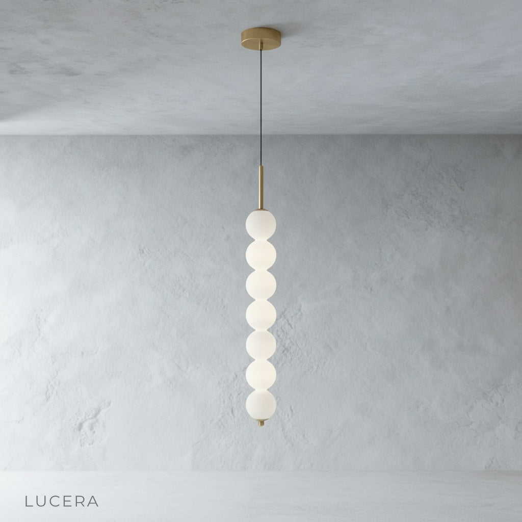 Meridian Pendant Light glass shades casting soft shadows on neutral bedroom wall