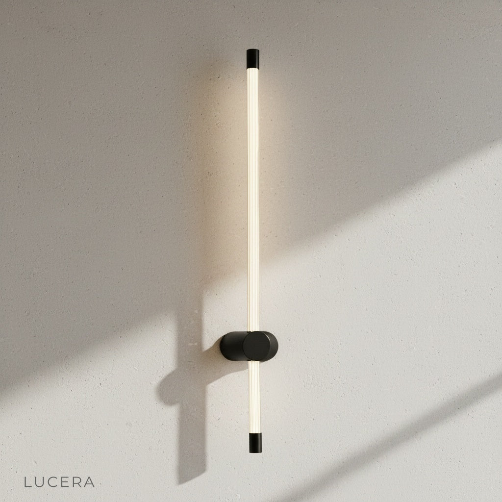 yoke wall lamp glowing at dusk in a cozy living room with sofa and rug