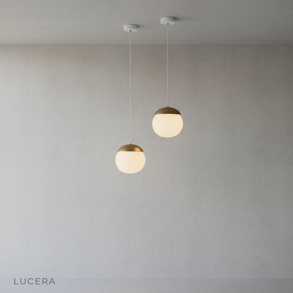 Holly wood-look pendant light paired with wooden table and ceramic decor in dining area