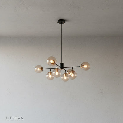 Yett chandelier in luxury hotel-style entryway with marble floor and mirror