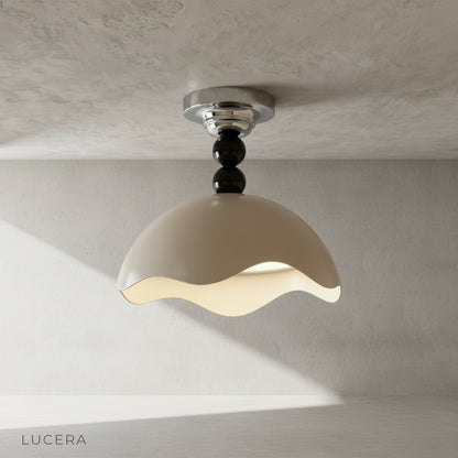 Aegis ceiling light in brushed metal finish against a clean white ceiling