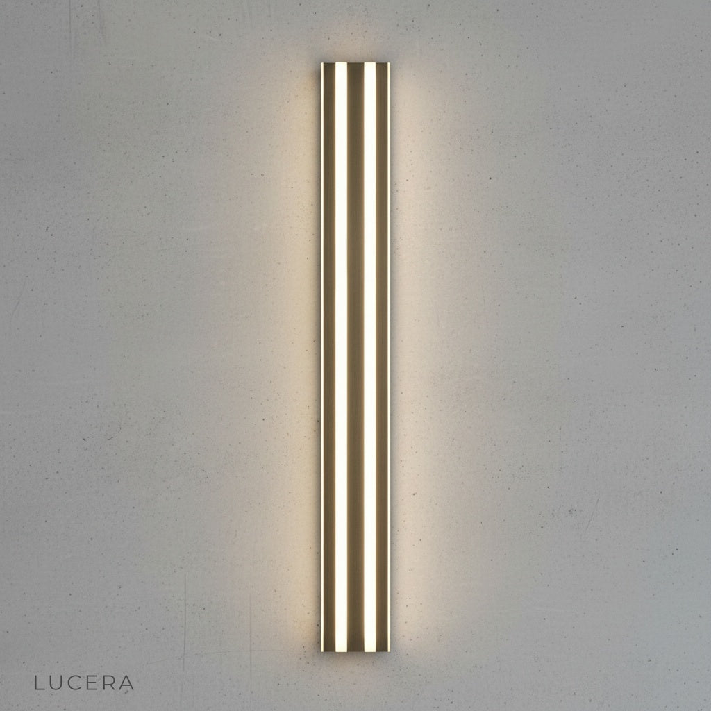 Hesperus wall lamp acrylic shade glowing warmly against dark textured wall
