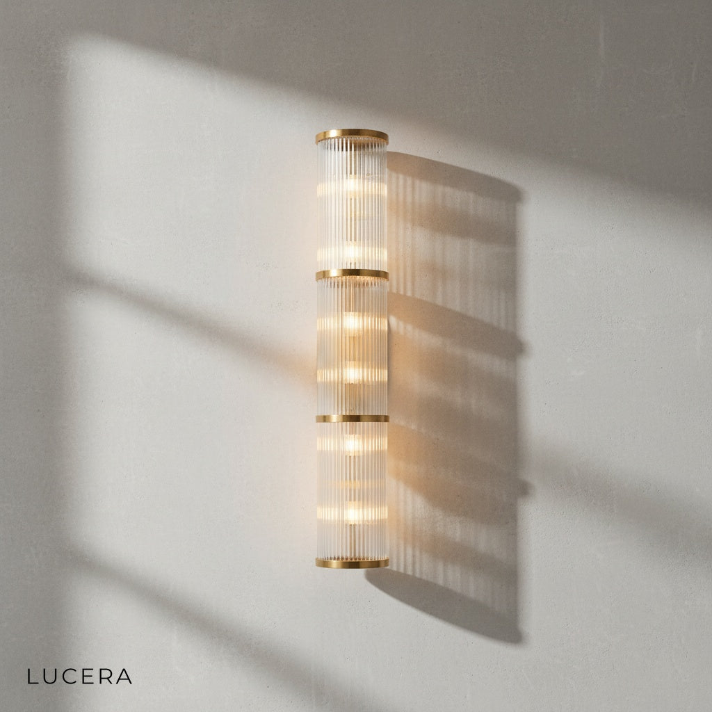outdoor IP44 rated Trill crystal sconce glowing on covered patio wall