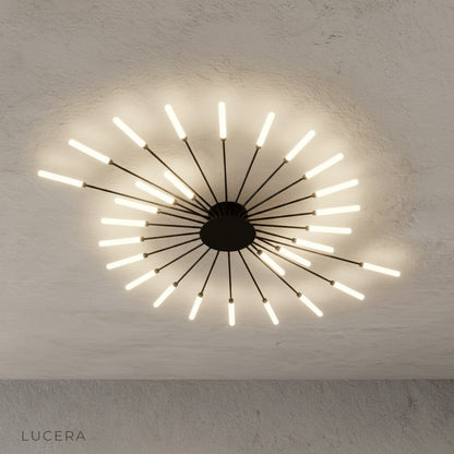 Karma chandelier in neutral bedroom with warm glow above bed for cozy nighttime ambiance