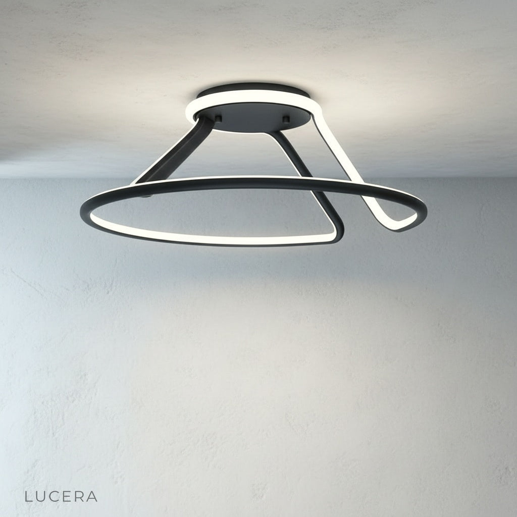 Loom ceiling light above cozy reading nook with armchair and books