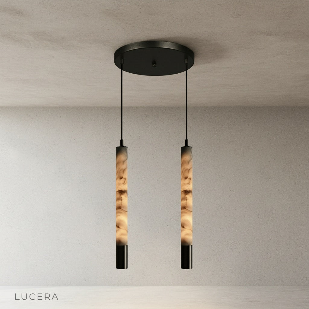 Yseult pendant light close-up of top canopy and steel suspension wire against white ceiling