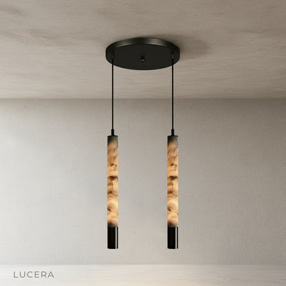 Yseult pendant light close-up of top canopy and steel suspension wire against white ceiling