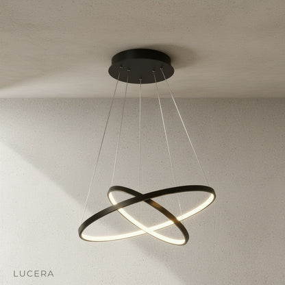 large wash chandelier hanging above modern wooden dining table in loft
