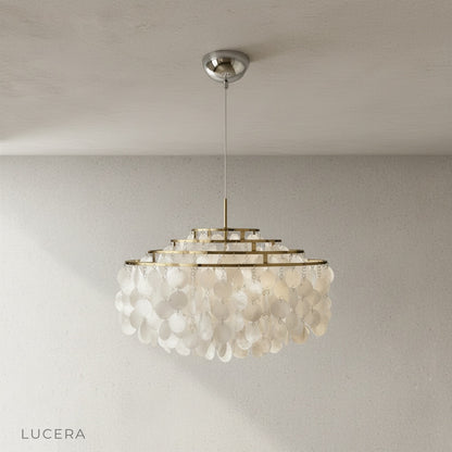 Zwing Chandelier as ceiling fixture in a minimalist bedroom with linen bedding and soft morning light