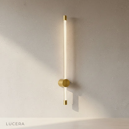 white yoke wall lamp paired with a minimalist desk setup in a home office