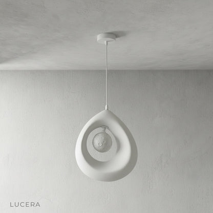 Kelp pendant light over marble island in contemporary kitchen, daytime