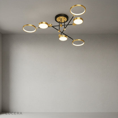 Black yin-yang ceiling light in cozy reading nook with warm light and wooden furniture