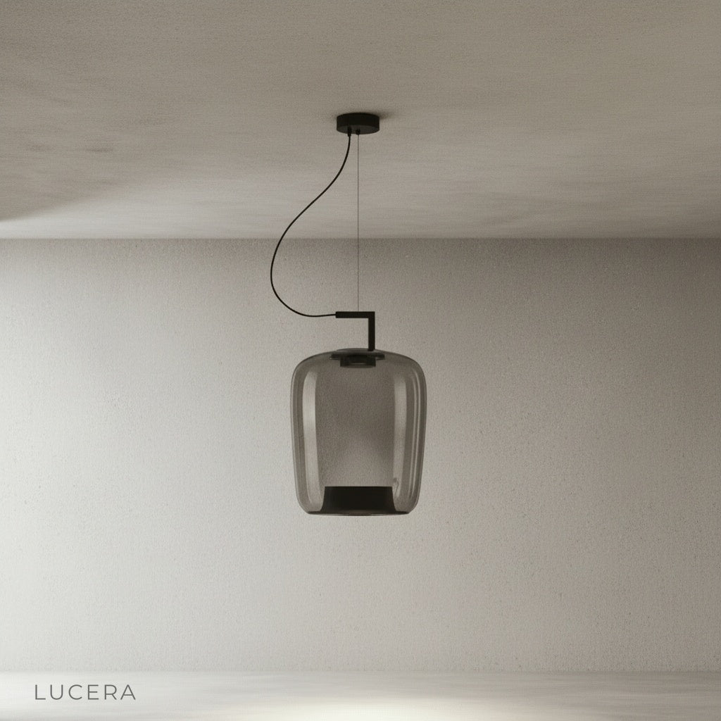 Yardang pendant light hanging over rustic farmhouse table with vintage chairs and candles