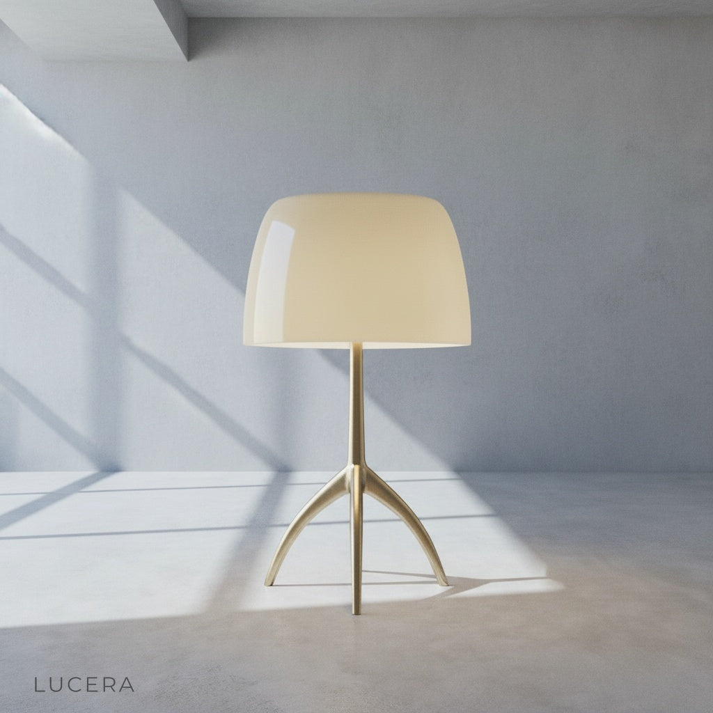 Albescent Table Lamp casting ambient light on a reading chair and ottoman in a dim corner
