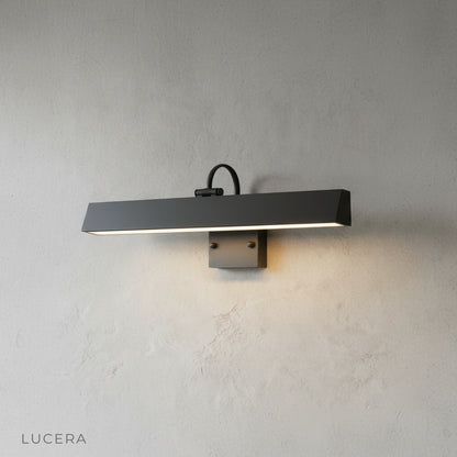 Two Quiete wall lamps flanking an entrance with soft ambient glow