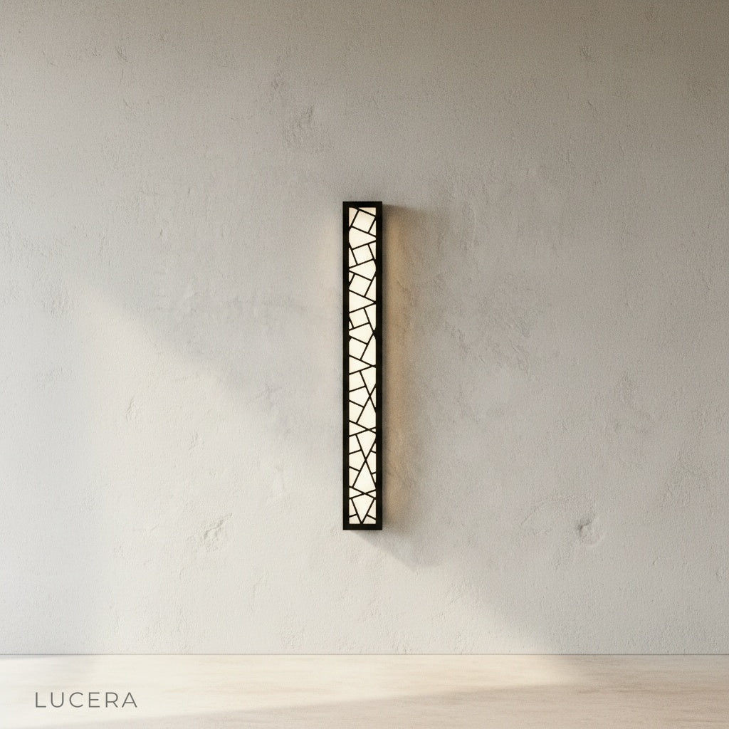 Emblem Wall Lamp blending with a wooden deck and green plants in daylight